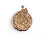 a gold coin pendant with a woman ' s face on it