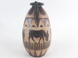 a vase with a horse on it on a white background