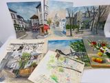 quatre tableaux représentant une scène de rue, posés sur une table