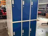 a large blue locker in the middle of a warehouse