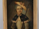 un vieux tableau représentant une femme coiffée d'un chapeau, posé sur un chevalet