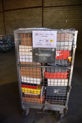 a metal cart with a sign on it in a warehouse