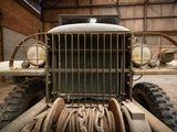 a old truck that is parked inside of a building
