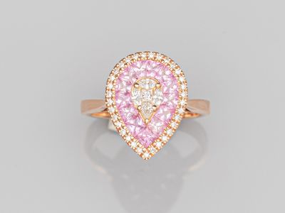 a pink and white diamond ring set in 18k rose gold