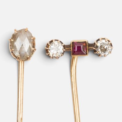 two pairs of gold tone ear pins with crystal stones