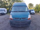 a blue van parked in a parking lot next to other vehicles