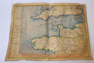 an old map of the british isles is displayed on a table