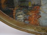 a picture of a painting on a table with a clock on it