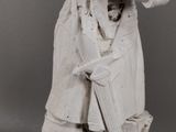 black and white photograph of a statue of a man with a cane