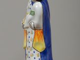 a figurine of a woman with a crown on her head