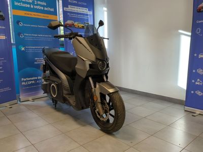 a scooter that is parked in a showroom