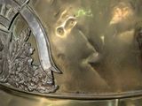 a gold fireman ' s helmet on display on a table