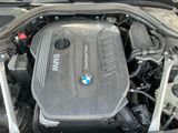 the engine of a bmw car with its hood open