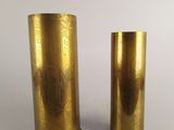pair of brass vases on a white background