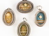 quatre serrures anciennes en argent et émail, ornées de motifs variés