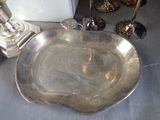 a silver plate that is sitting on a table