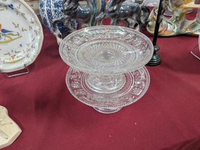 a table with a red table cloth and a glass bowl on it