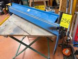 a blue machine that is sitting on a table