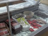 a display case filled with assorted foods and snacks