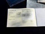 a passport and a passport book sitting on a table