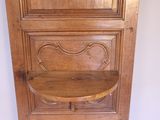 a wooden shelf that has a shelf on top of it