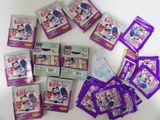 a lot of purple and white items on a table