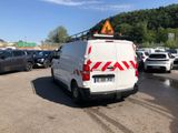 a white van that is parked in a parking lot