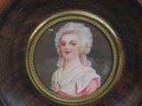 a picture of a woman in a pink dress in a picture frame
