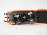 a close up of a toy train on a white surface
