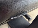 a close up of a black leather seat on a bicycle
