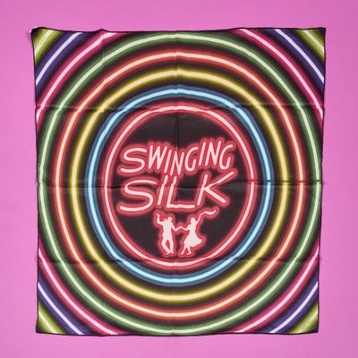 a close up of a neon sign on a pink background