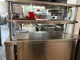 a large stainless steel kitchen with lots of counter space