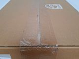 a cardboard box with a sticker on it and a sticker on the side of the box