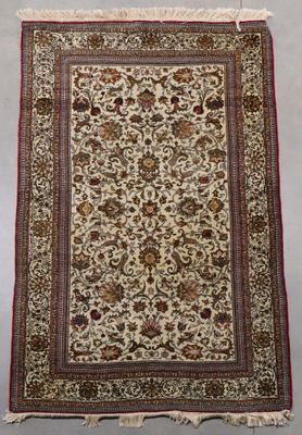 a rug with a floral design on a white ground