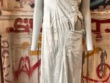 a mannequin in a room with graffiti on the walls