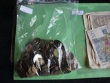 a pile of coins and a bag of money on a table