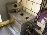 une photo d'une cuisine avec une cuisinière