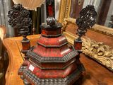 a wooden table with a lamp on top of it