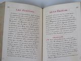 an open book with a page in it on a table
