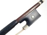 a bow that is attached to a bow with a wooden handle