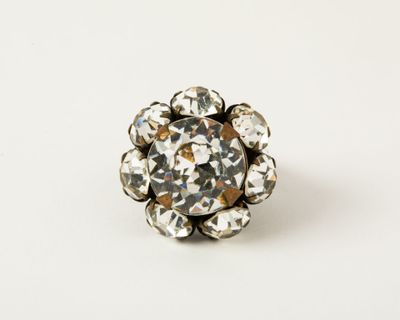 a close up of a ring with a flower design on it