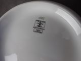 a white plate with a black and white label on it