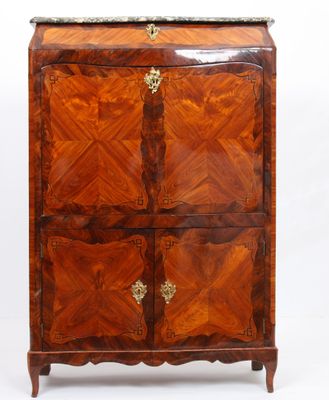 an antique chest of drawers with a marble top and two doors
