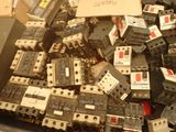 a pile of electrical equipment that is sitting on top of a table