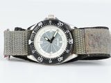 a watch that is sitting on top of a watch band