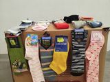 many pairs of socks on display on a pallet