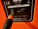 an orange guitar amp sitting on top of an orange chair