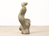 an image of a sculpture of a woman sitting on top of a tree stump