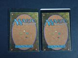two decks of magic the gathering are shown on a table