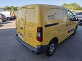 a yellow van that is parked in a parking lot